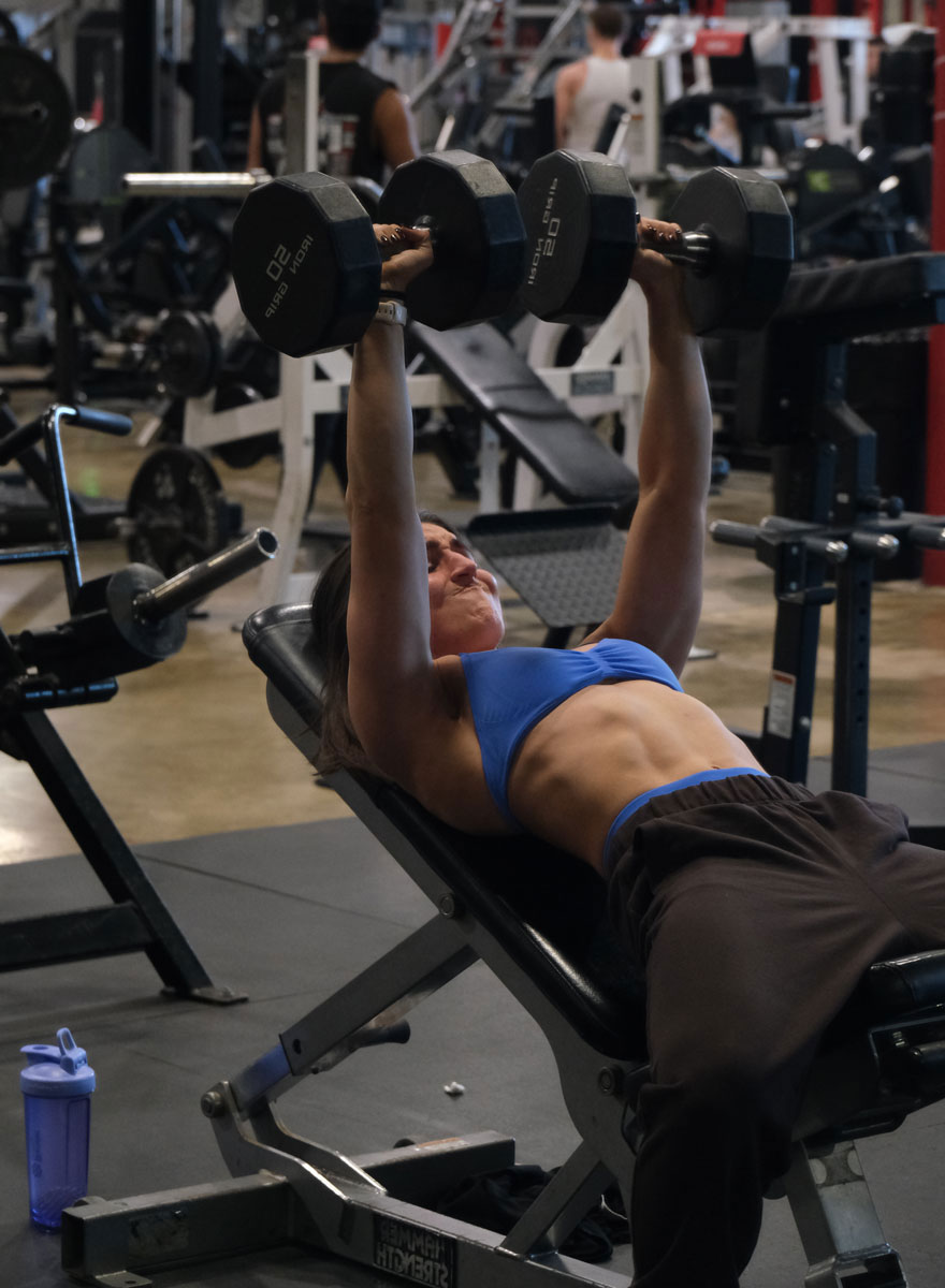 The coach is working out at the gym.