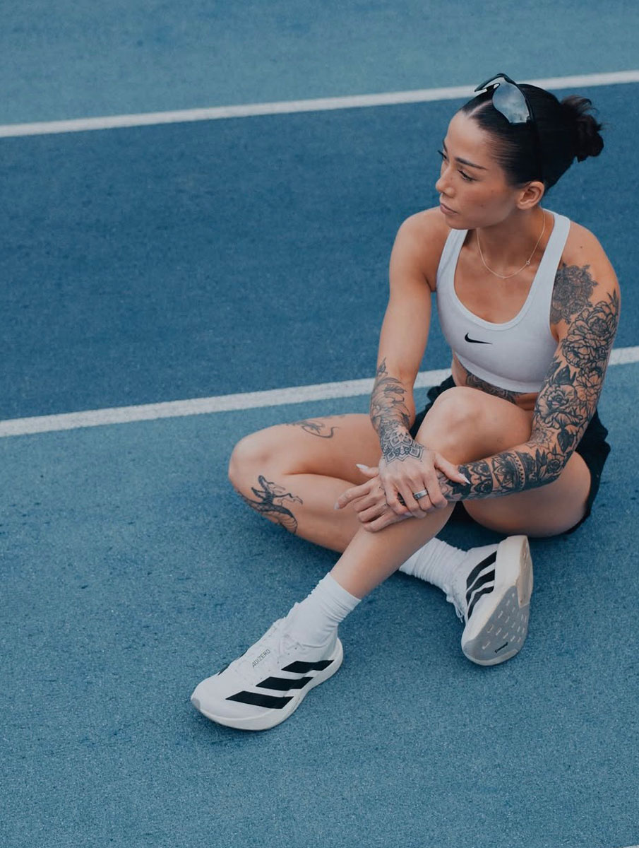 The coach is posing while sitting.