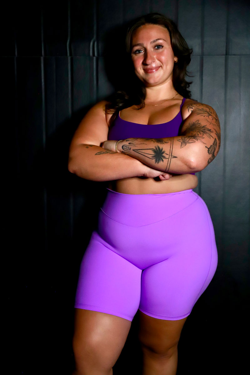 The coach is posing with her confidence.