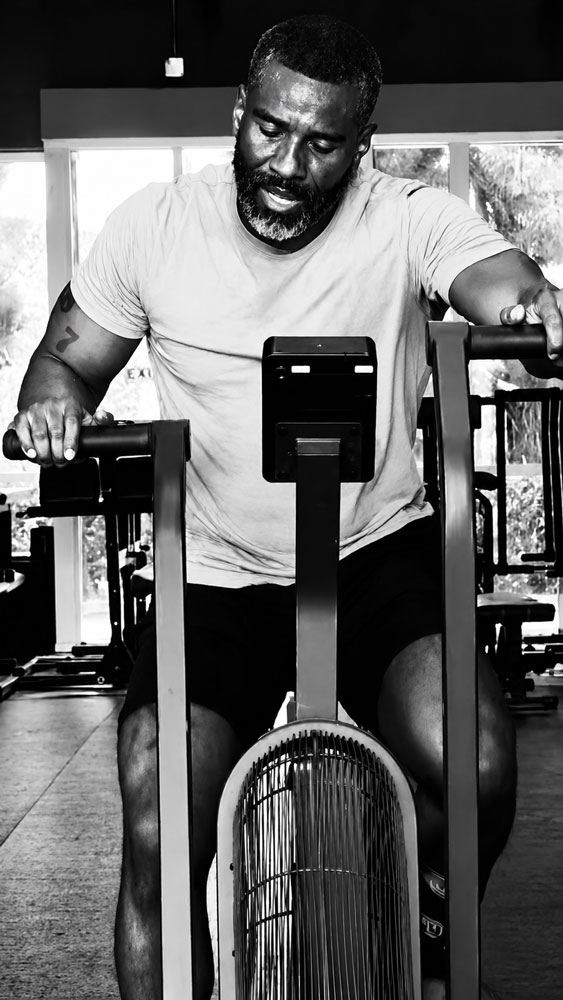 The coach is working out at the gym.