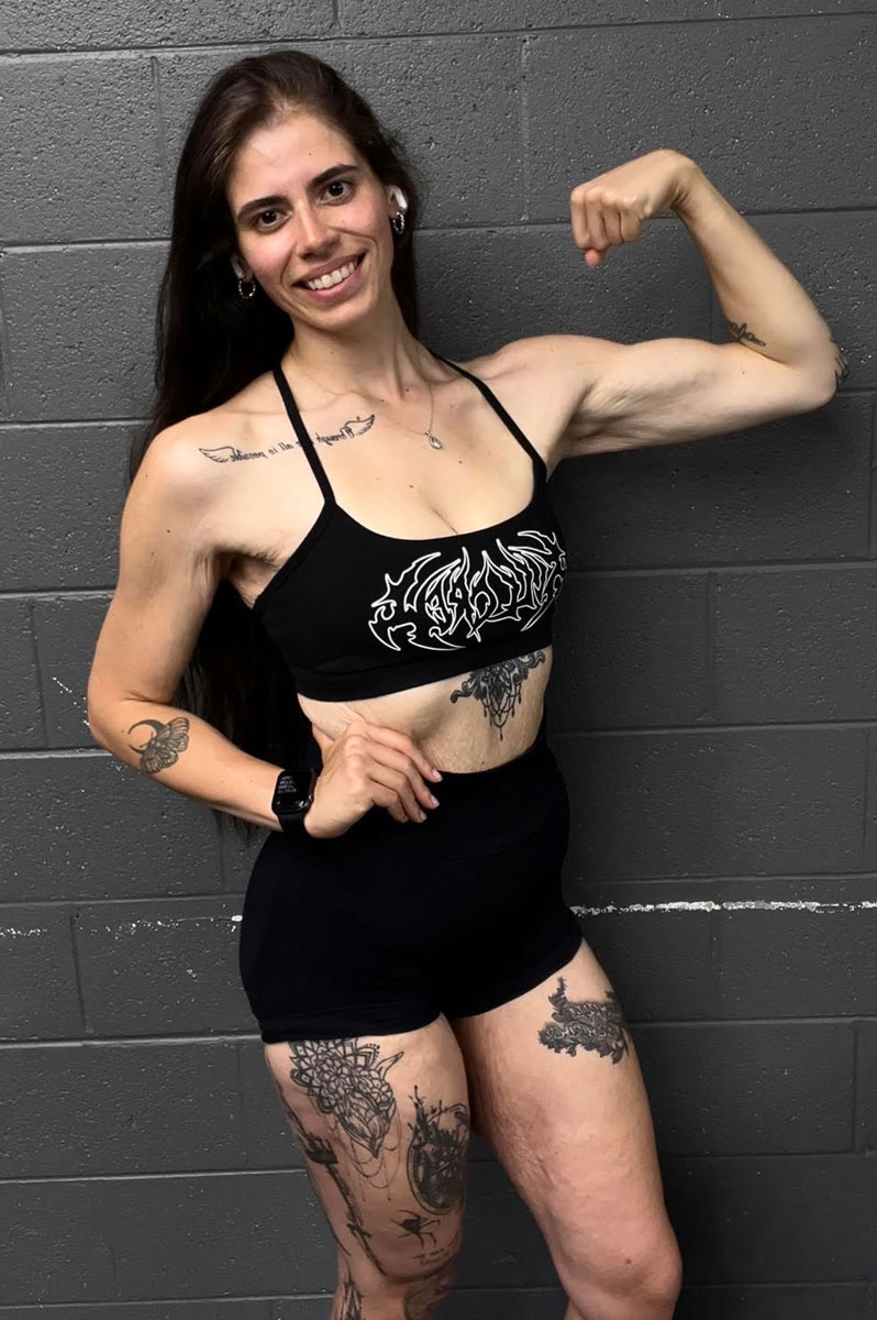 The coach is posing with her confidence.